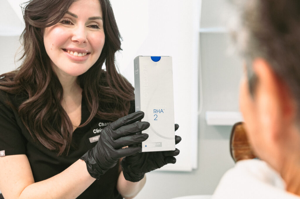 A provider holds a box of RHA2 used for lip filler near Hamilton.