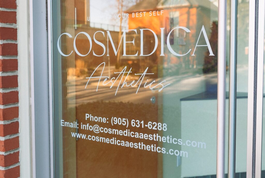 The decal on Cosmedica Aesthetics' front door, where they provide lip filler.